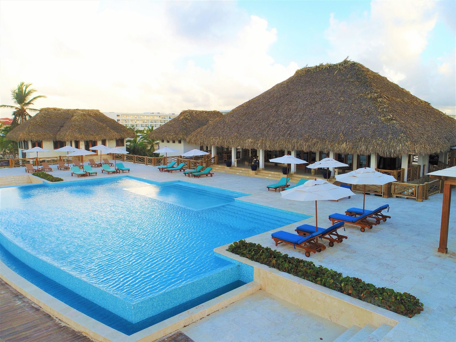 Cana Bay Beach Club pool and palapas