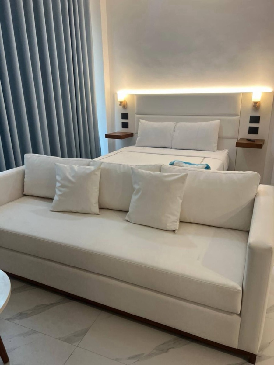Bedroom with queen bed and sofa bed